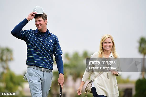 Hudson Swafford celebrates with his wife Katherine Wainwright Brandon after putting in to win during the final round of the CareerBuilder Challenge...