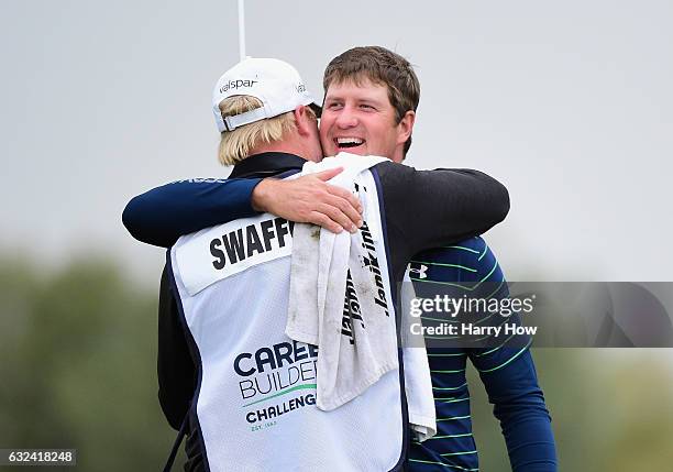 Hudson Swafford celebrates with caddie D.J. Nelson during the final round of the CareerBuilder Challenge in partnership with The Clinton Foundation...