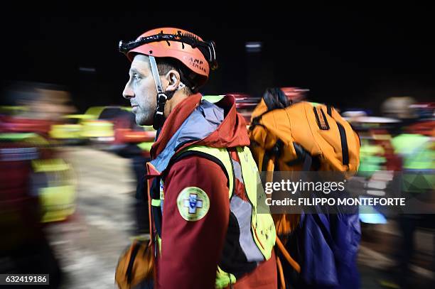 Members of the Corpo Nazionale Soccorso Alpino e Speleologico arrive to rest at the rescue operations center in Penne, some 20 km from the site of an...