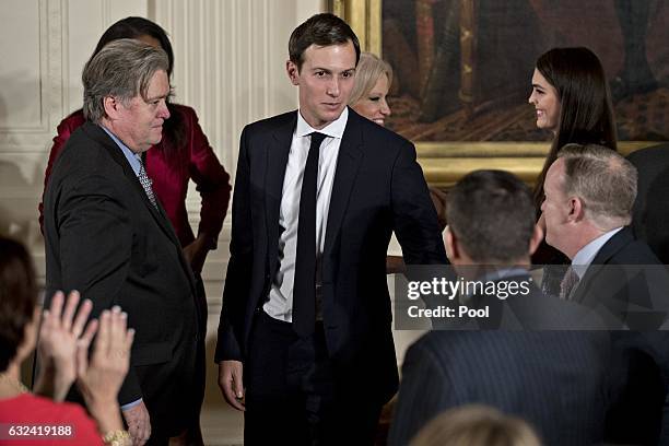 Jared Kushner, senior White House adviser and Stephen "Steve" Bannon, chief strategist for U.S. President Donald Trump attend a swearing in ceremony...