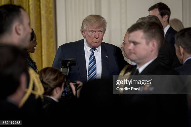President Donald Trump walks out during a swearing in ceremony of White House senior staff in the East Room of the White House on January 22, 2017 in...