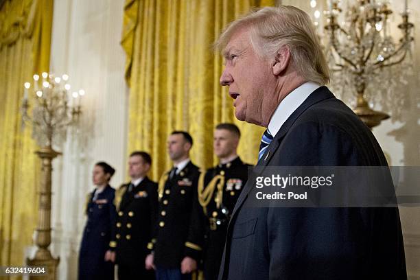 President Donald Trump arrives to a swearing in ceremony of White House senior staff in the East Room of the White House on January 22, 2017 in...