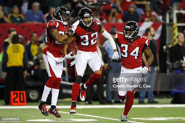 Jalen Collins of the Atlanta Falcons is congratulated by his teammates against the Green Bay Packers during the third quarter in the NFC Championship...