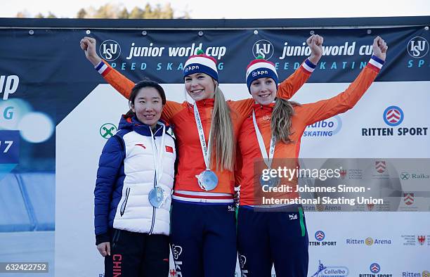 Mei Han of China and Jutta Leerdam and Sanne in 't Hof of the Netherlands pose during the medal ceremony after winning the women's junior 1500 m draw...