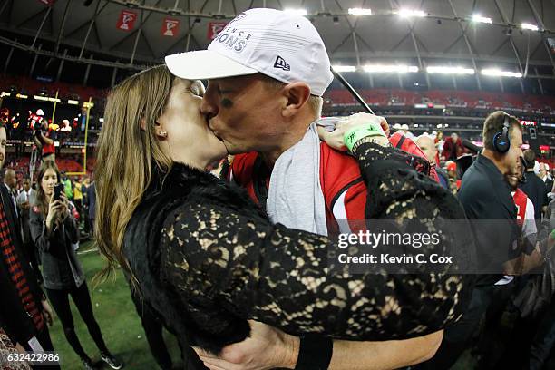 Matt Ryan of the Atlanta Falcons celebrates with wife Sarah Marshall after defeating the Green Bay Packers in the NFC Championship Game at the...