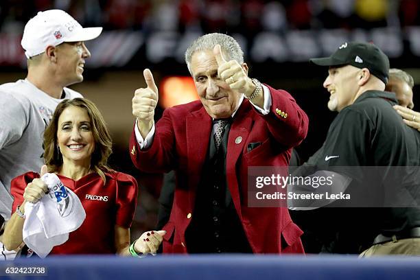 Atlanta Falcons owner Arthur Blank celebrates after defeating the Green Bay Packers with Angela Macuga in the NFC Championship Game at the Georgia...