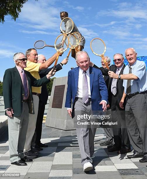 Tennis legends Ken Rosewall, John Newcombe, Fed Stolle, Roy Emerson, Frank Sedgman and Neale Fraser form a guard of honour for Australian legend Rod...