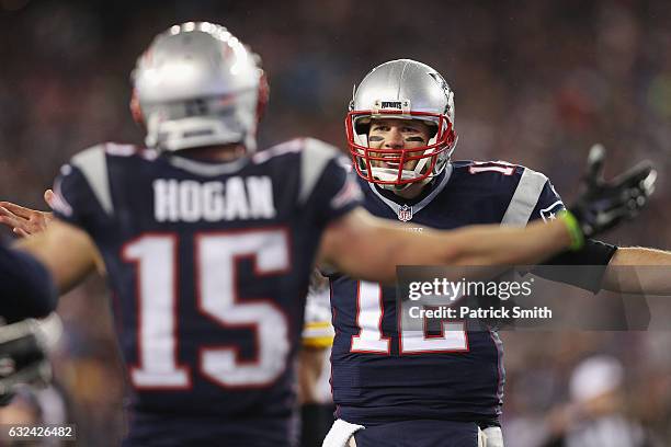 Chris Hogan celebrates with Tom Brady of the New England Patriots after making a 34-yard touchdown reception during the second quarter against the...