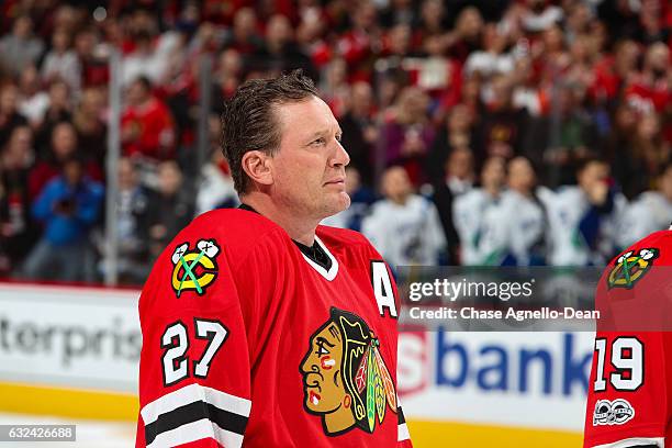 Former Chicago Blackhawks forward Jeremy Roenick is honored during the Blackhawks "One More Shift" campaign prior to the game against the Vancouver...