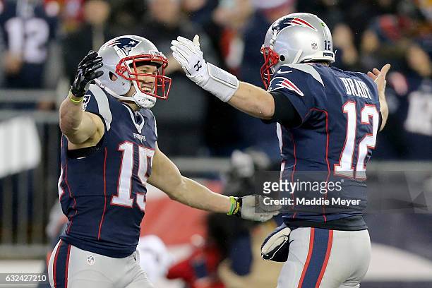 Chris Hogan celebrates with Tom Brady of the New England Patriots after making a 34-yard touchdown reception during the second quarter against the...