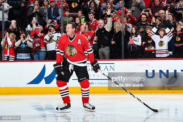 Former Chicago Blackhawks forward Jeremy Roenick is honored during the Blackhawks "One More Shift" campaign prior to the game against the Vancouver...