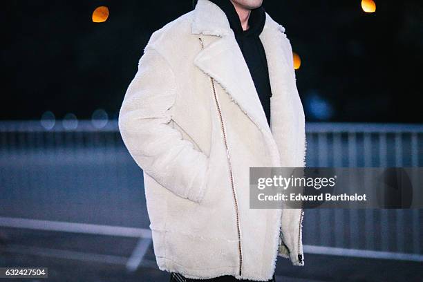 Guest is wearing a white faux fur coat, outside the Thom Browne show, during Paris Fashion Week Menswear Fall/Winter 2017/2018, on January 22, 2017...