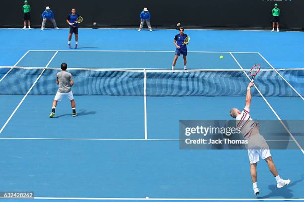 Jacco Eltingh and Paul Haarhuis of the Netherlands compete in the first round legends match against Michael Chang and Todd Martin of the United...