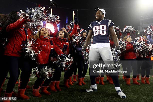 Martellus Bennett of the New England Patriots celebrates with cheerleaders after defeating the Pittsburgh Steelers 36-17 to win the AFC Championship...