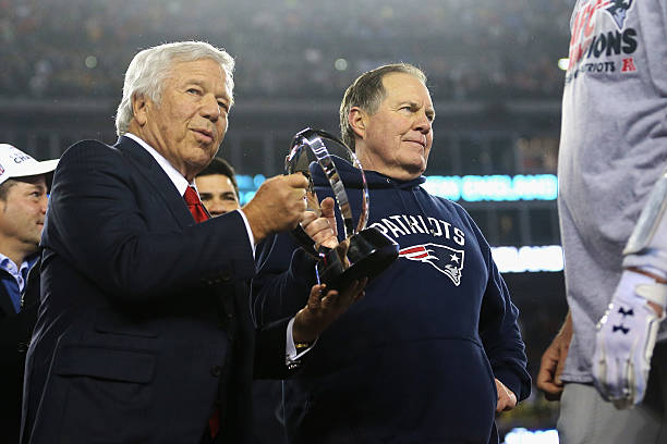 Robert Kraft, owner and CEO of the New England Patriots , and head coach Bill Belichick of the New England Patriots hold the Lamar Hunt Trophy after...
