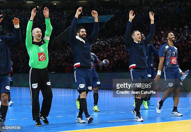 Goalkeeper of France Thierry Omeyer, Nikola Karabatic, Valentin Porte, Timothey N'Guessan and teammates celebrate their victory in front of 28 000...