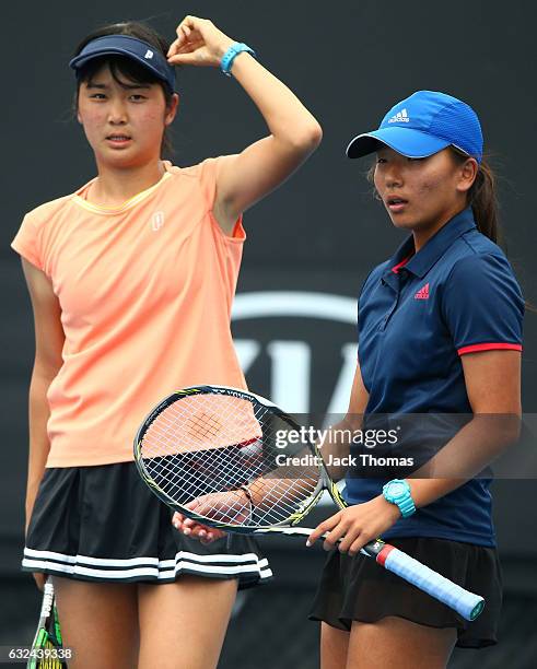 Anri Nagata of Japan and Thasaporn Naklo of Thailand compete in their first round match against Yi Tsen Cho and Joanna Garland of Taipei during the...