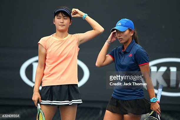 Anri Nagata of Japan and Thasaporn Naklo of Thailand compete in their first round match against Yi Tsen Cho and Joanna Garland of Taipei during the...
