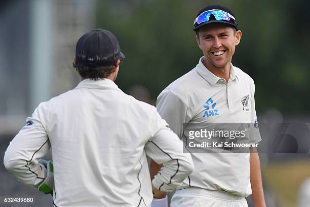 Watling of New Zealand is congratulated by Trent Boult of New Zealand after taking a catch to dismiss Rubel Hossain of Bangladesh all out during day...