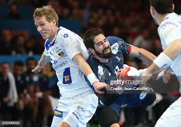 Nikola Karabatic of France and Olafur Andres Gudmundsson of Iceland in action during the 25th IHF Men's World Championship 2017 Round of 16 match...