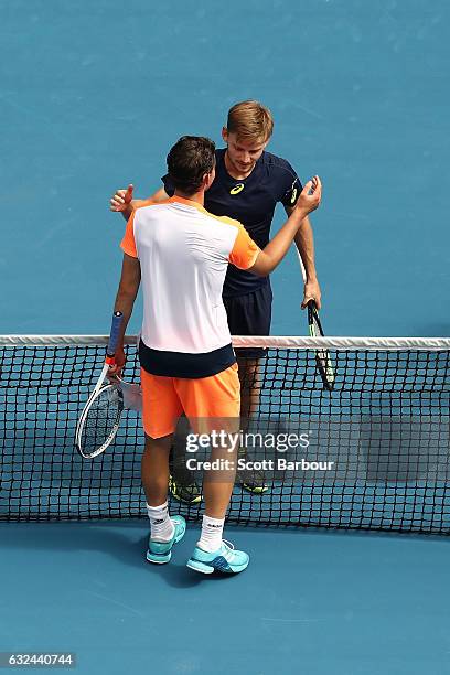 Dominic Thiem of Austria congratulates David Goffin of Belgium on winning his fourth round match on day eight of the 2017 Australian Open at...