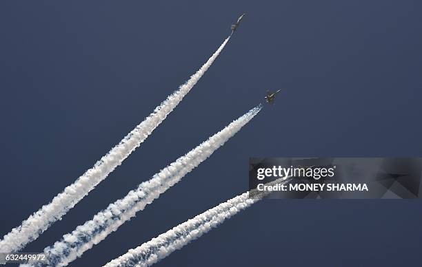 Indian fighter aircraft fly past during the full dress rehearsal for the upcoming Indian Republic Day parade in New Delhi on January 23, 2017. Crown...