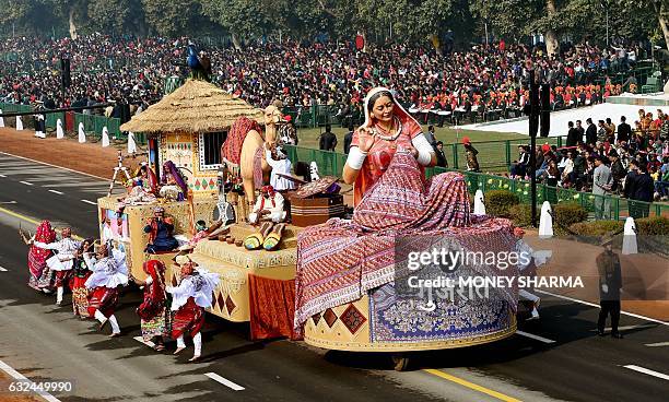 Tableaux of the Western Indian state of Gujarat take part in the full dress rehearsal for the upcoming Indian Republic Day parade in New Delhi on...