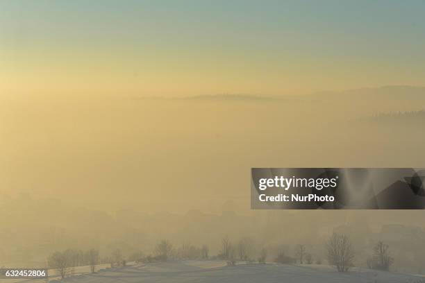 View of village covered by fog mixed with pollution near the Tatry mountain area. Air pollution in Poland continues to be at very high level. On...