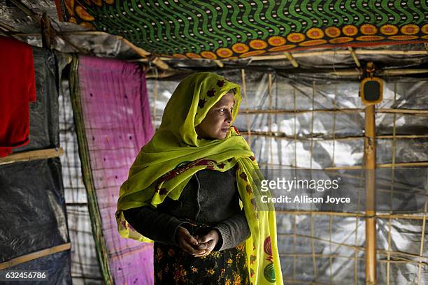 Nojiba is seen in her makeshift house that she shares with 14 other refugees on January 22, 2017 in Kutalong Rohingya refugee camp in Cox's Bazar,...