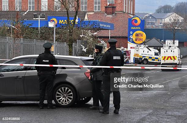 Police officers pictured at the scene of the shooting of a PSNI officer at a petrol station on the Crumlin road on January 23, 2017 in Belfast,...