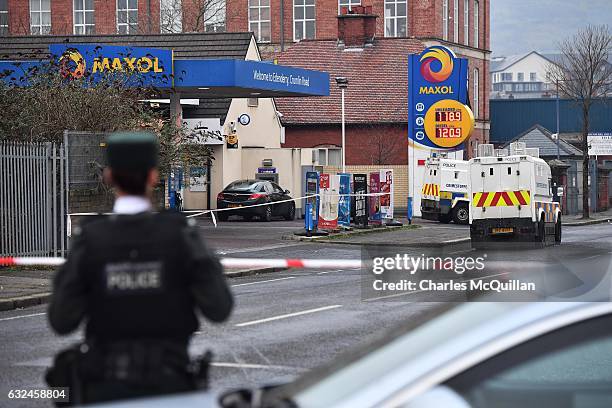 Police officers pictured at the scene of the shooting of a PSNI officer at a petrol station on the Crumlin road on January 23, 2017 in Belfast,...