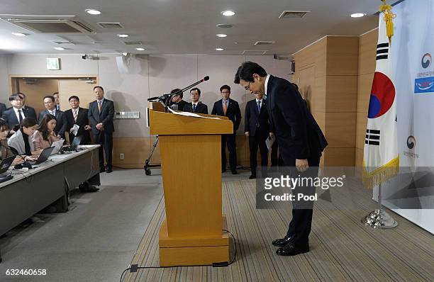 South Korean acting President and Prime Minister Hwang Kyo-ahn bows to the nation during the New Year's press conference at the government complex on...