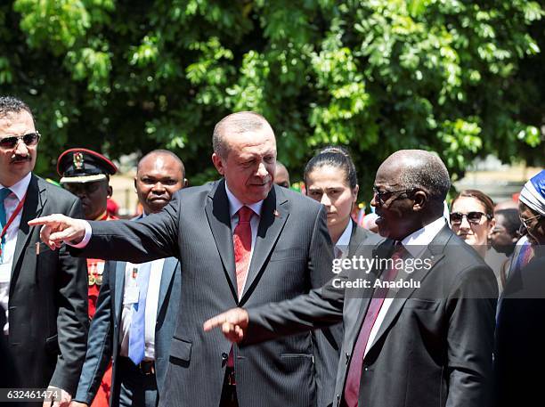 Turkish President Recep Tayyip Erdogan is welcomed by Tanzanian President John Magufuli during an official welcoming ceremony in Dar Es Salaam,...