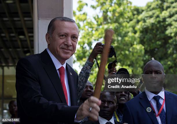 President of Turkey Recep Tayyip Erdogan plays a traditional drum during an official welcoming ceremony in Dar es Salaam, Tanzania on January 23,...