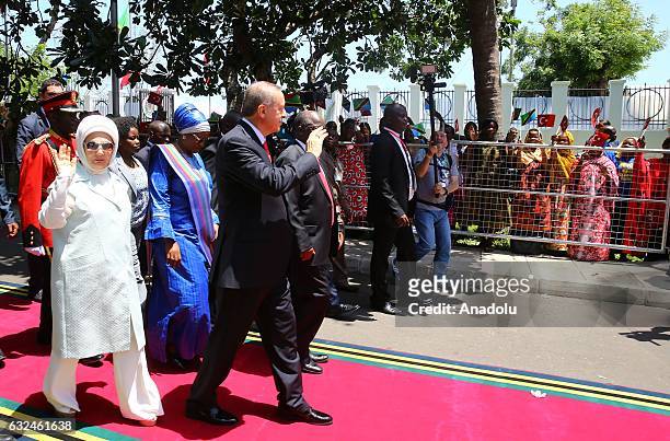 President of Turkey Recep Tayyip Erdogan and his wife Emine Erdogan wave to Tanzanian people during official welcoming ceremony in Dar es Salaam,...