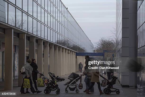 Shoppers walk through the 'Intu' Shopping Centre on January 23, 2017 in Milton Keynes, England. Milton Keynes in Buckinghamshire marks the 50th...