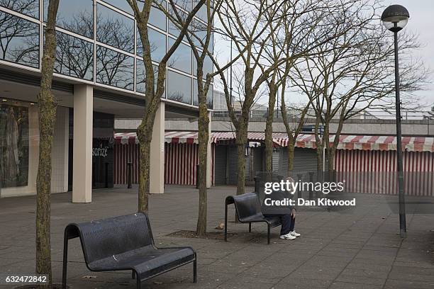 Man sits outside the 'Intu' Shopping Centre on January 23, 2017 in Milton Keynes, England. Milton Keynes in Buckinghamshire marks the 50th...