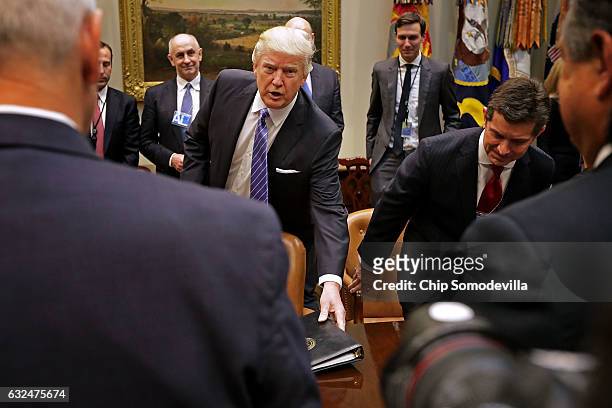 President Donald Trump arrives for a meeting with invited business leaders, including Alex Gorsky of Johnson & Johsnson, and members of his staff,...