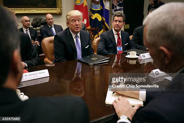 President Donald Trump leads a meeting with invited business leaders, including Alex Gorsky of Johnson & Johsnson , and members of his staff in the...