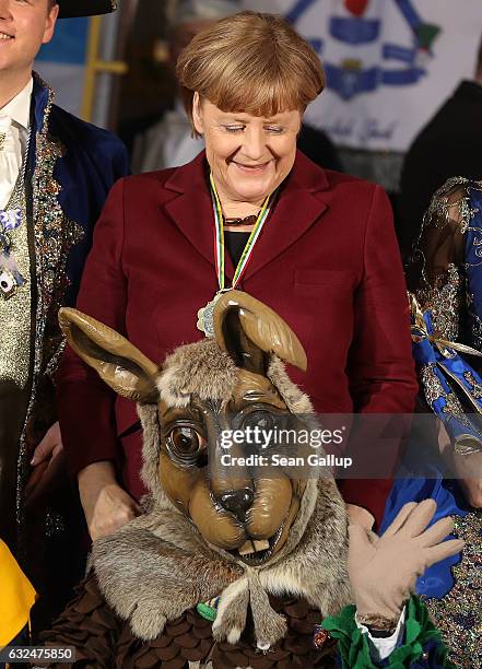 German Chancellor Angela Merkel meets a Carnival delegation from Bavaria during the annual Carnival reception at the Chancellery on January 23, 2017...