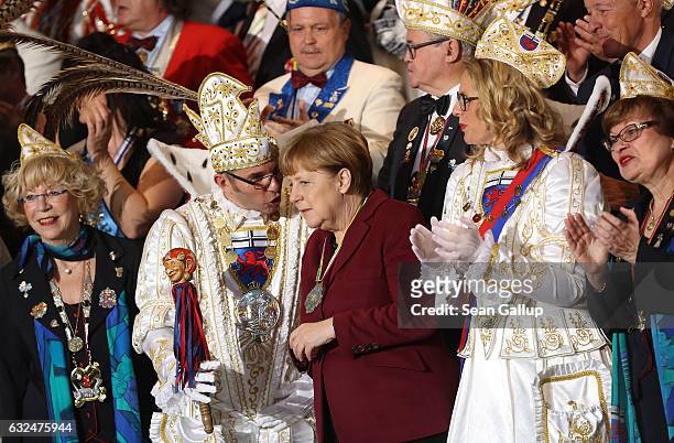German Chancellor Angela Merkel chats with Carnival delegates during the annual Carnival reception at the Chancellery on January 23, 2017 in Berlin,...