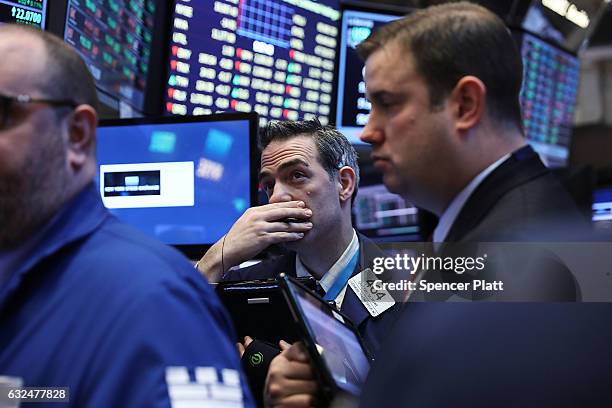 Traders work on the floor of the New York Stock Exchange on the first day of trading after Donald Trump was sworn in as president on January 23, 2017...