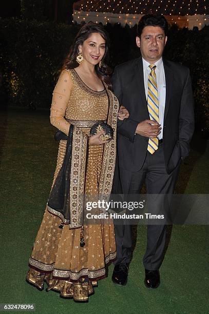 Bollywood actor Madhuri Dixit with husband Ram Nene during wedding reception of Trishya Screwvala, daughter of media tycoon and philanthropist Ronnie...