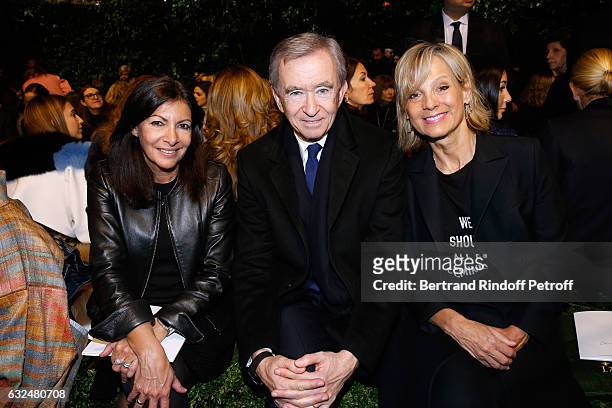 Mayor of Paris Anne Hidalgo, Owner of LVMH Luxury Group Bernard Arnault and his wife Helene Arnault attend the Christian Dior Haute Couture Spring...