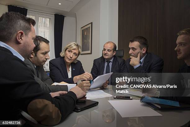 French politician and president of the National Front, Marine Le Pen is photographed at campaign headquarters with Bruno Bilde, Sebastien Chenu,...