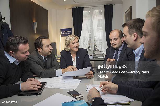 French politician and president of the National Front, Marine Le Pen is photographed at campaign headquarters with Bruno Bilde, Sebastien Chenu,...