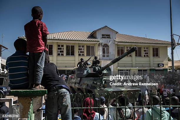 Troops from Senegal gather outside the Gambian statehouse on January 23, 2017 in Banjul, The Gambia. ECOWAS is in Gambia to ensure a safe transition...