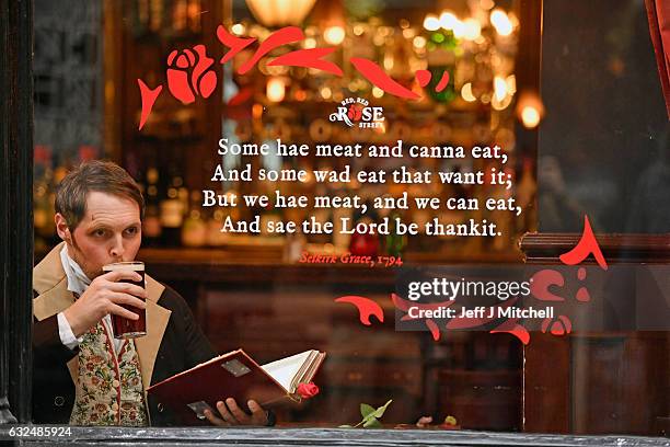 Gareth Morrison dressed a Robert Burns has a pint in a pub to promote the Red, Red Rose festival on January 23, 207 in Edinburgh,Scotland. Red, Red...