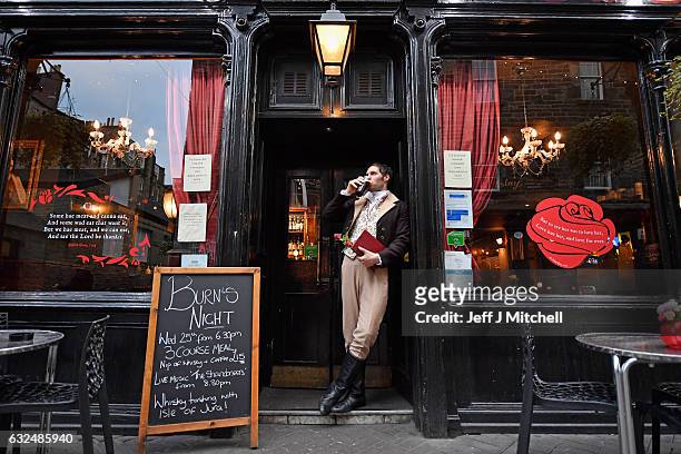 Gareth Morrison dressed a Robert Burns has a pint in a pub to promote the Red, Red Rose festival on January 23, 207 in Edinburgh,Scotland. Red, Red...