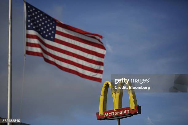 An American flag flies outside a McDonald's Corp. Fast food restaurant in White House, Tennessee, U.S., on Wednesday, Jan. 18, 2017. McDonald's...